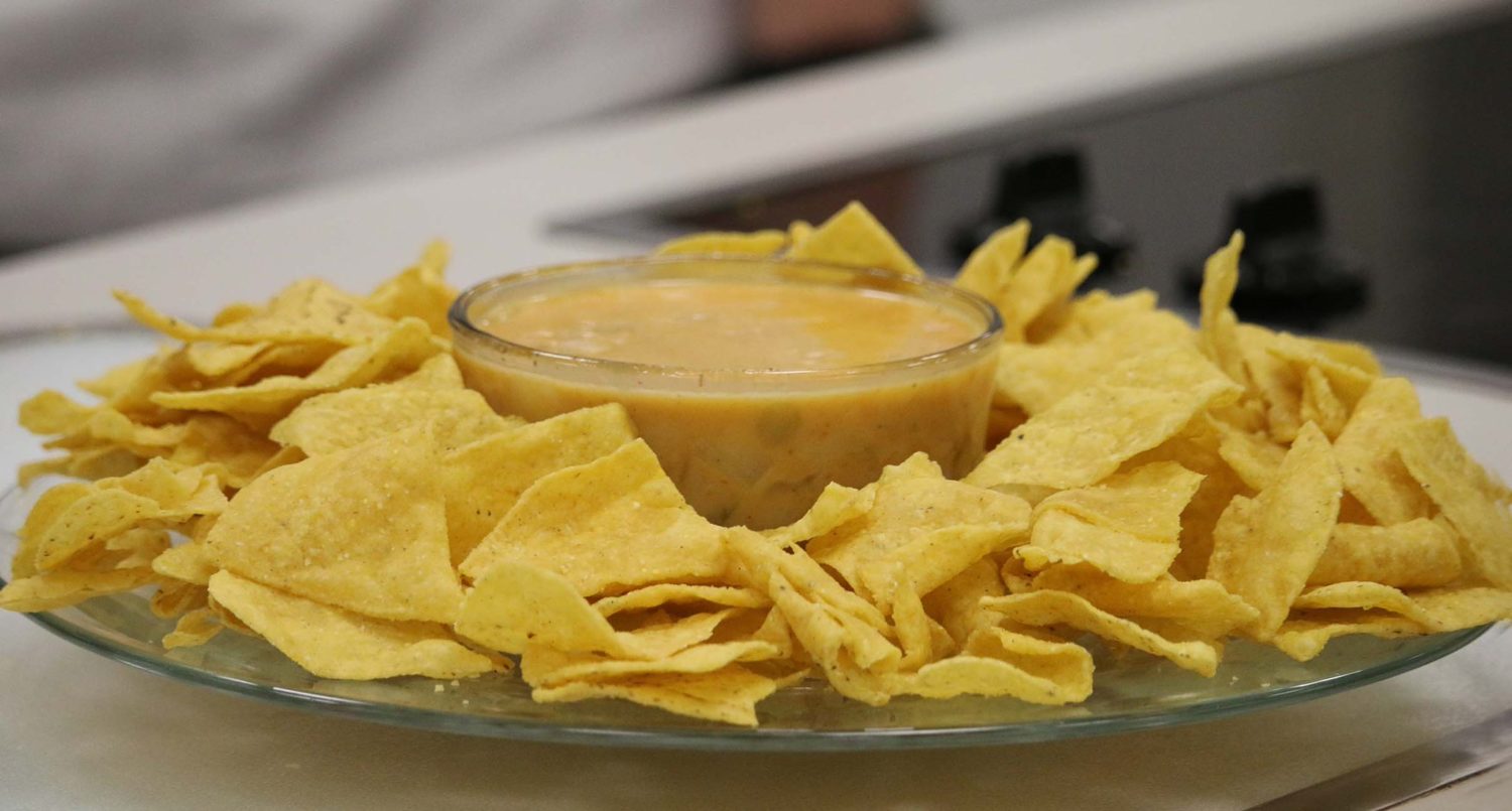 Photo of chili con queso dip and chips.