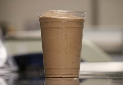 Milkshake in a clear plastic cup