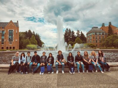 Group picture in front of University of Washington fountain on the 2022 campus trip