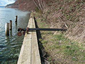 Pipe extending from the slope to the water