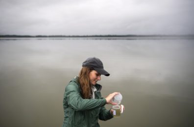 Woman taking a water sample