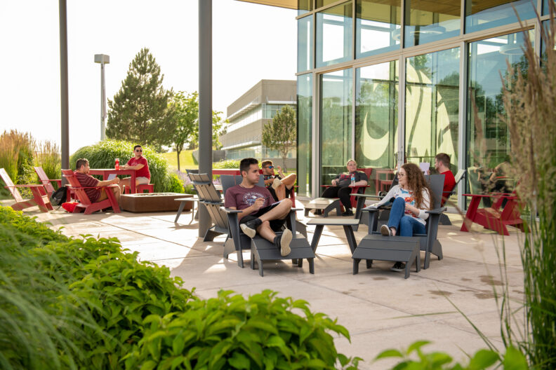 Groups of students meeting outside.