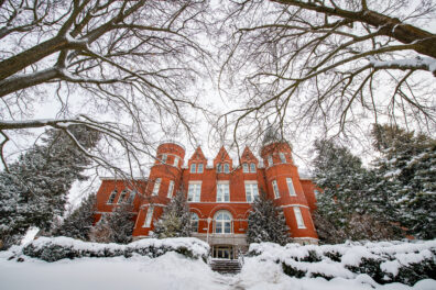 Dynamic view of Thompson Hall in the snow.