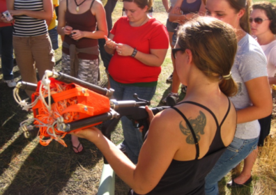A student using an instrument in the field.