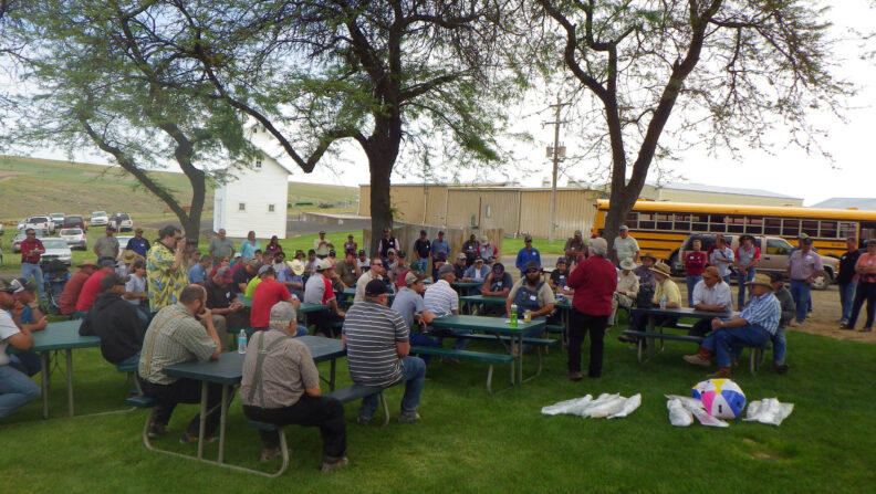 Ann Kennedy giving a speech in the yard.