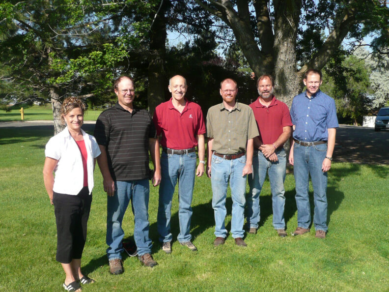 Group standing in a lawn.