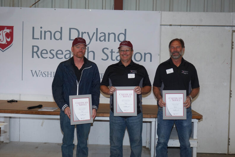 John Jacobsen, Bruce Sauer, and Brian Fode receiving awards.