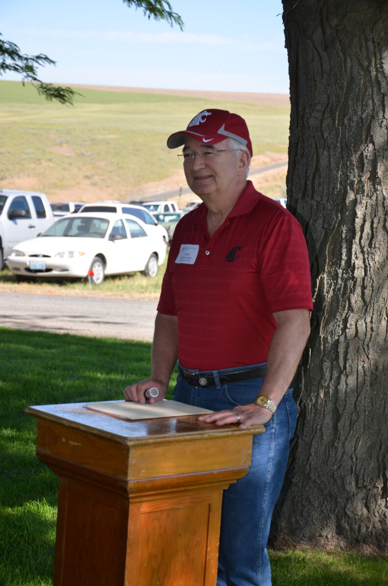 Ron Mittelhammer speaking at a podium.