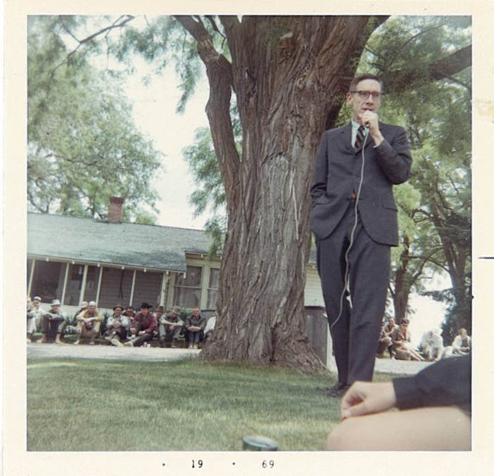 Man holding a microphone.
