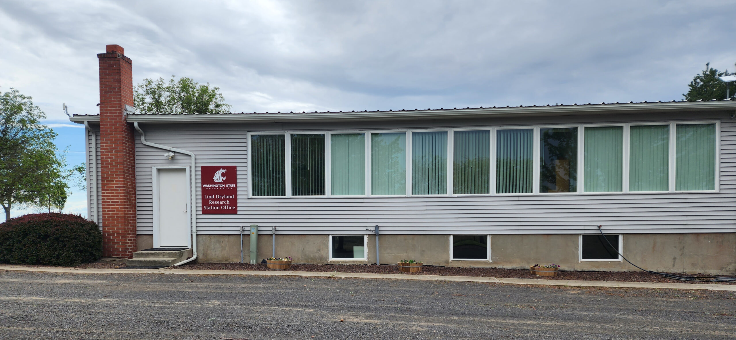 Office building with sign that says "Washington State University Lind Dryland Research Station Office."