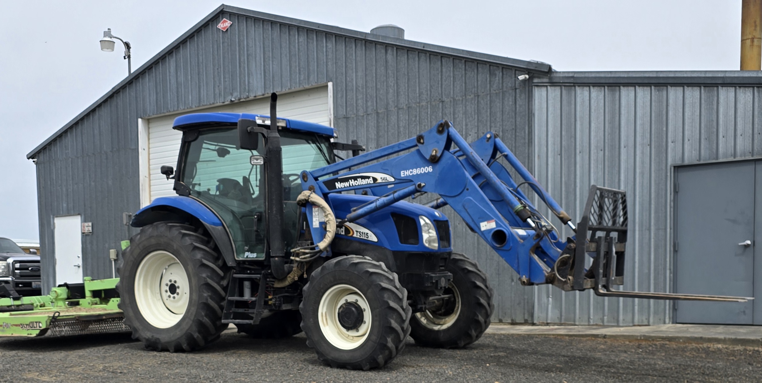 Tractor in front of a building.