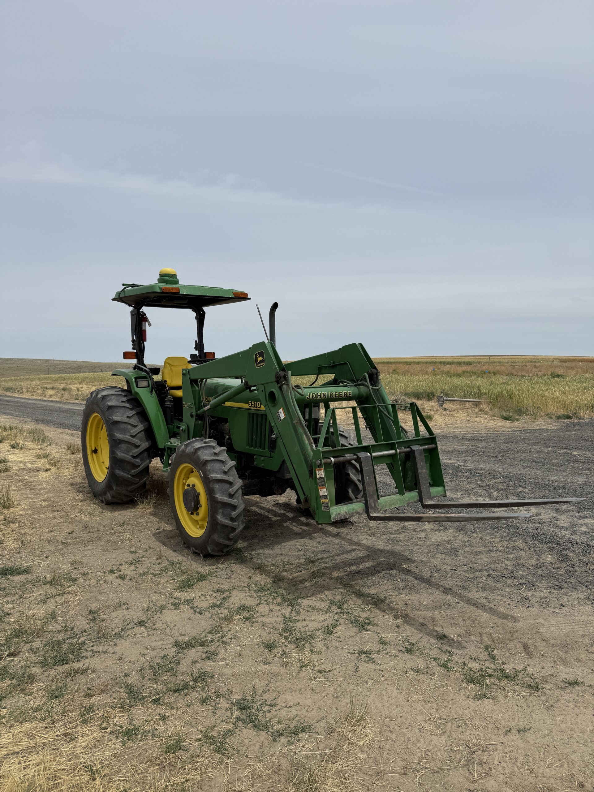 Tractor on the side of a road.