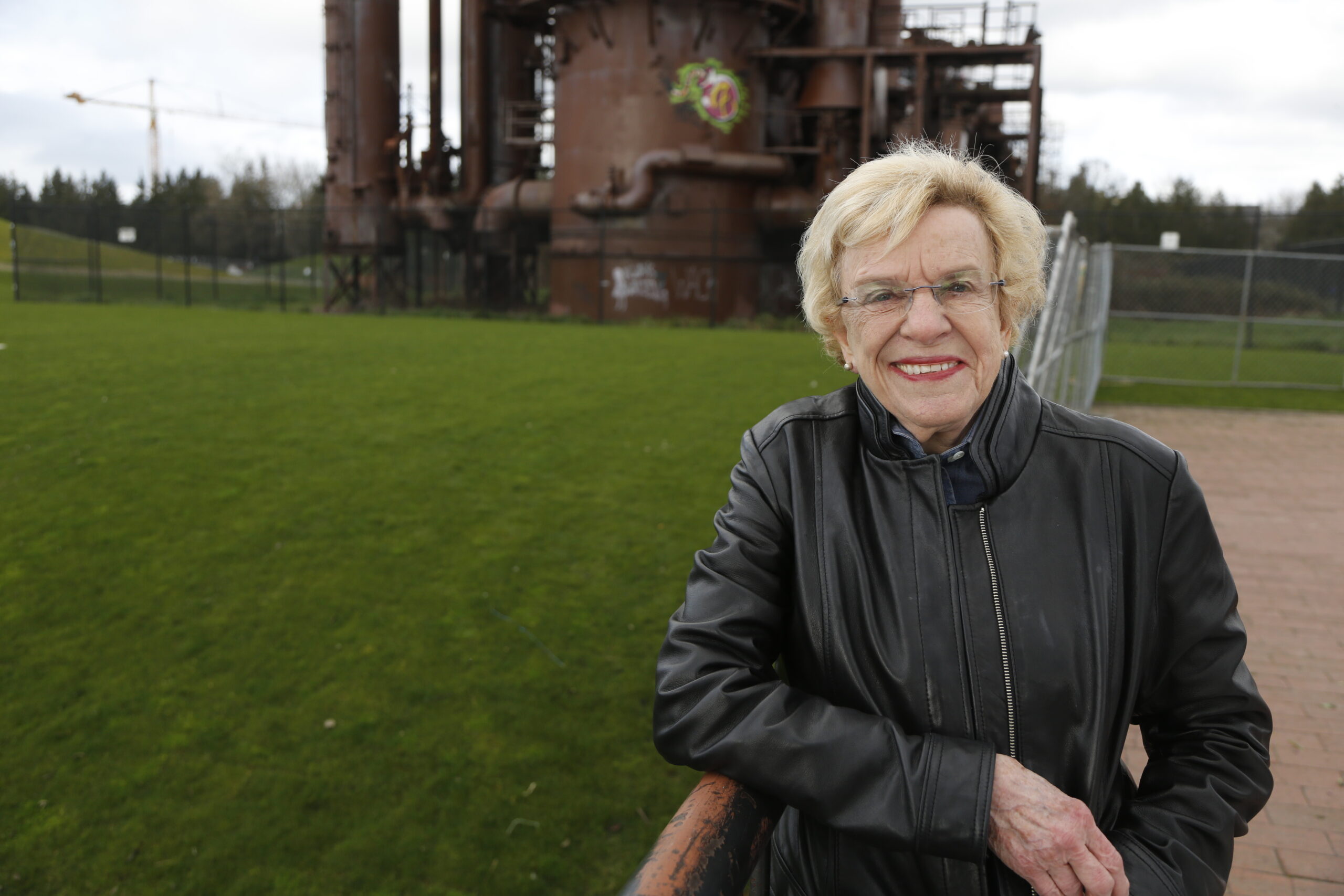Jean Godden standing in front of a structure