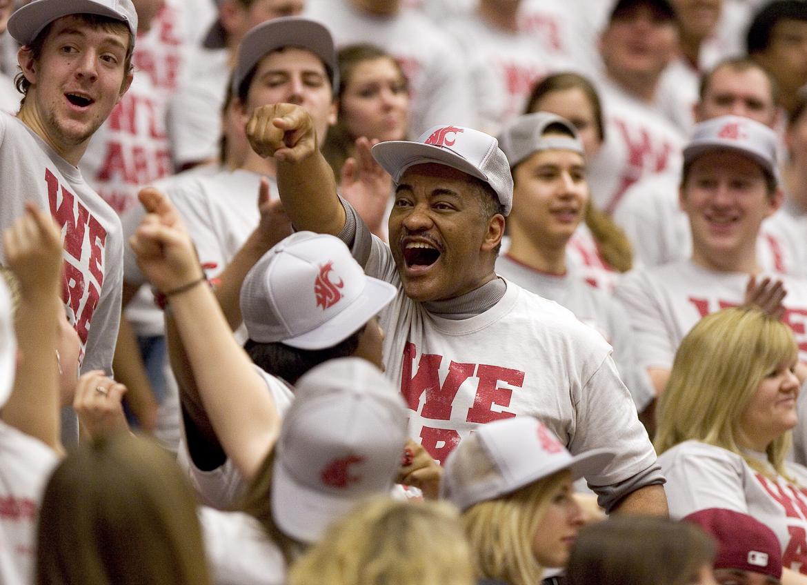 WSU President Elson Floyd in crowd cheering at UCLA v. WSU basketball game