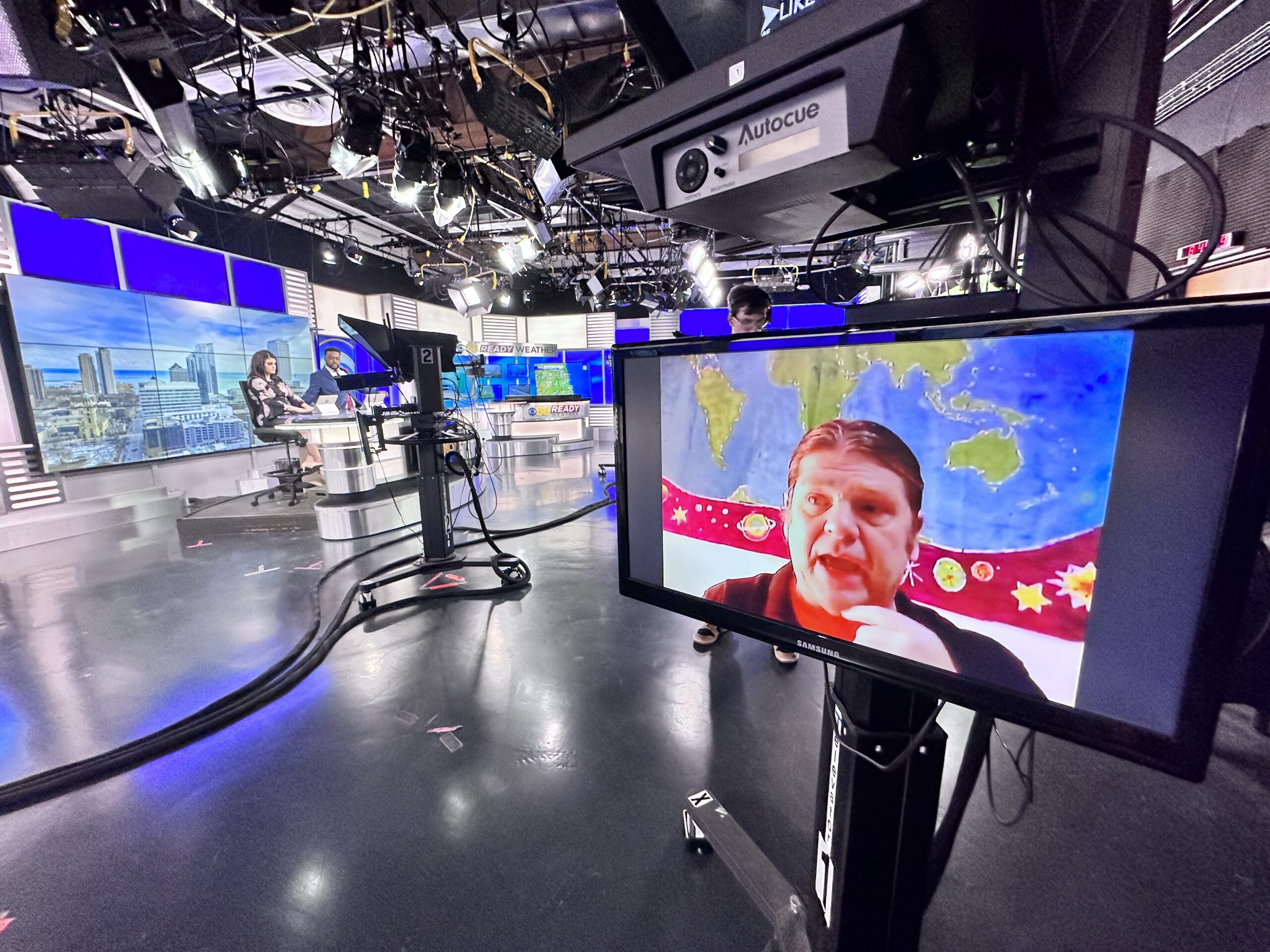 photo of Milwaukee's CBS58newsroom with Tom Haig on a screen