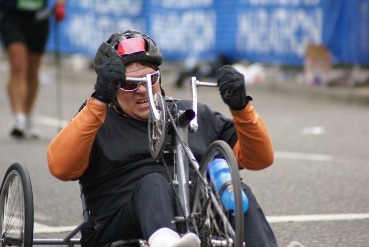 photo of Tom Haig competing in a marathon using a hand cycle