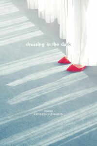 cover of Dressing in the Dark, showing pointy red shoes peeking out from behind a curtain
