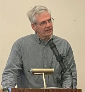 Jack Nisbet speaking at a podium