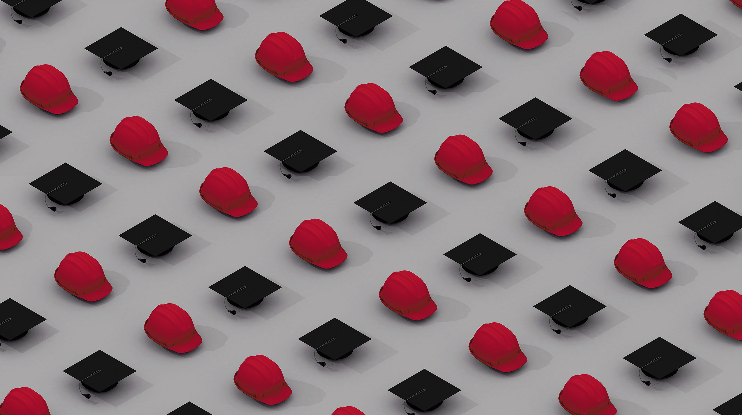 Aerial view of a repeating grid of alternating graduation caps and crimson hard hats.